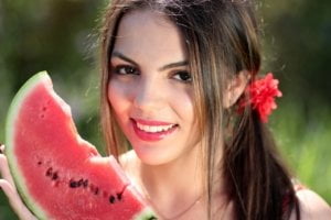 Women eating watermelon - food trend 2020