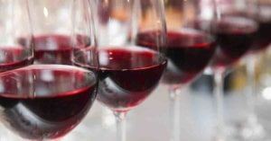 A close up photo of wine in many drinking glass to help us understanding red wine better