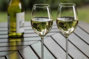 A close up photo of white wine in two drinking glasses to help us in understanding white wine